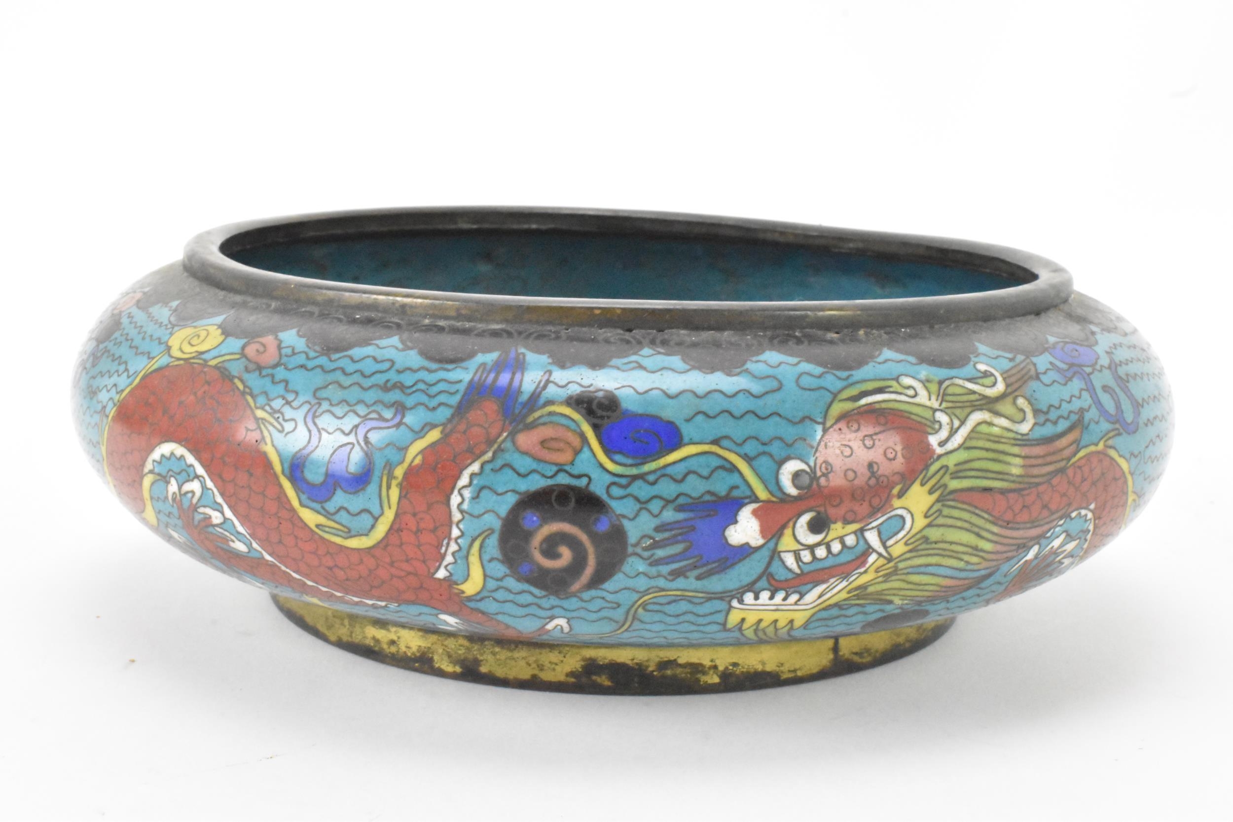 A Chinese cloisonne bowl, late 19th/early 20th century, of shallow form, decorated on a blue - Image 2 of 6
