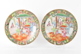 A pair of Chinese export Canton Famille Rose plates, Qing Dynasty, late 19th century, each decorated