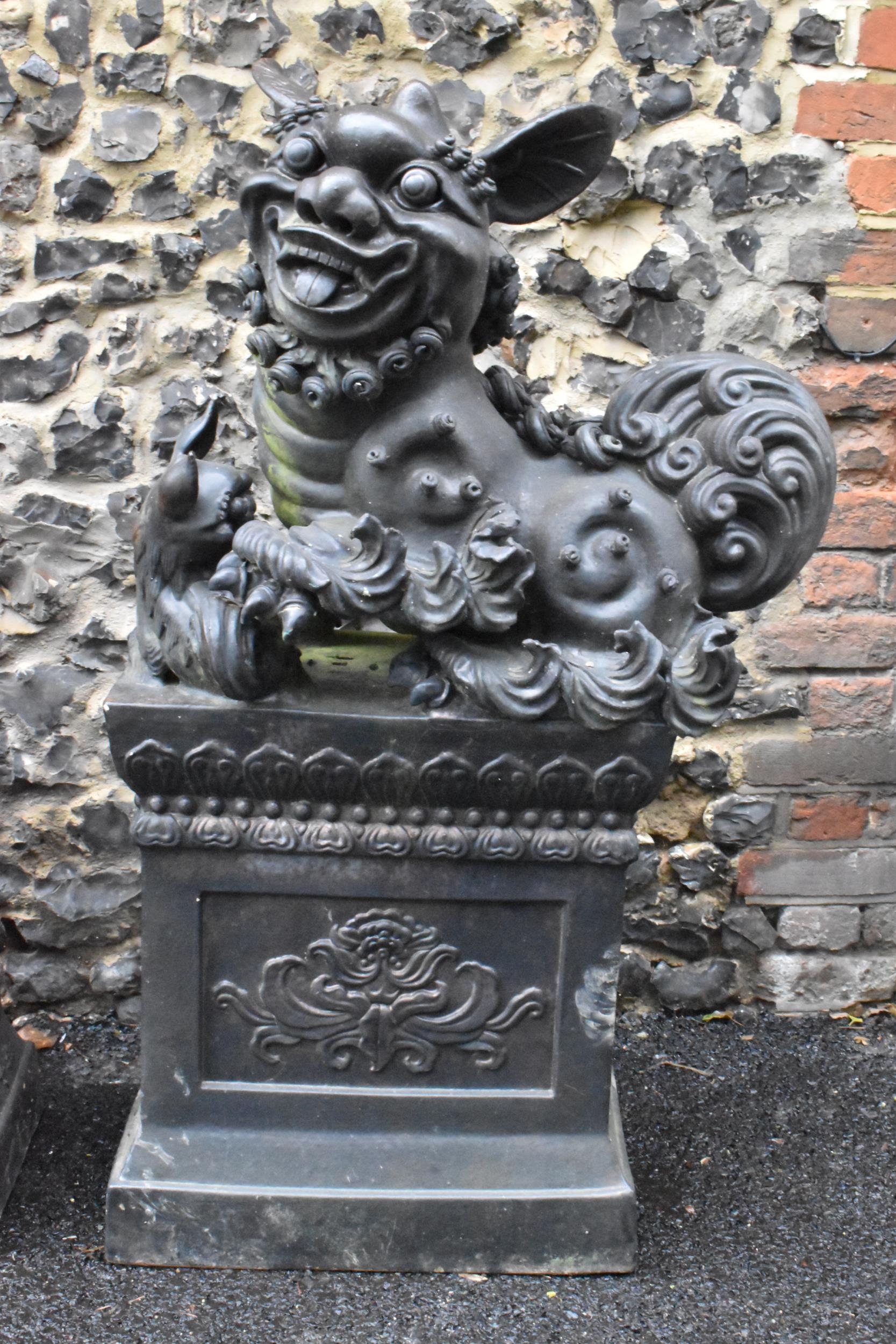 A pair of mid/late 20th century earthenware garden statues of Chinese foo dogs, both in a dark - Image 2 of 13