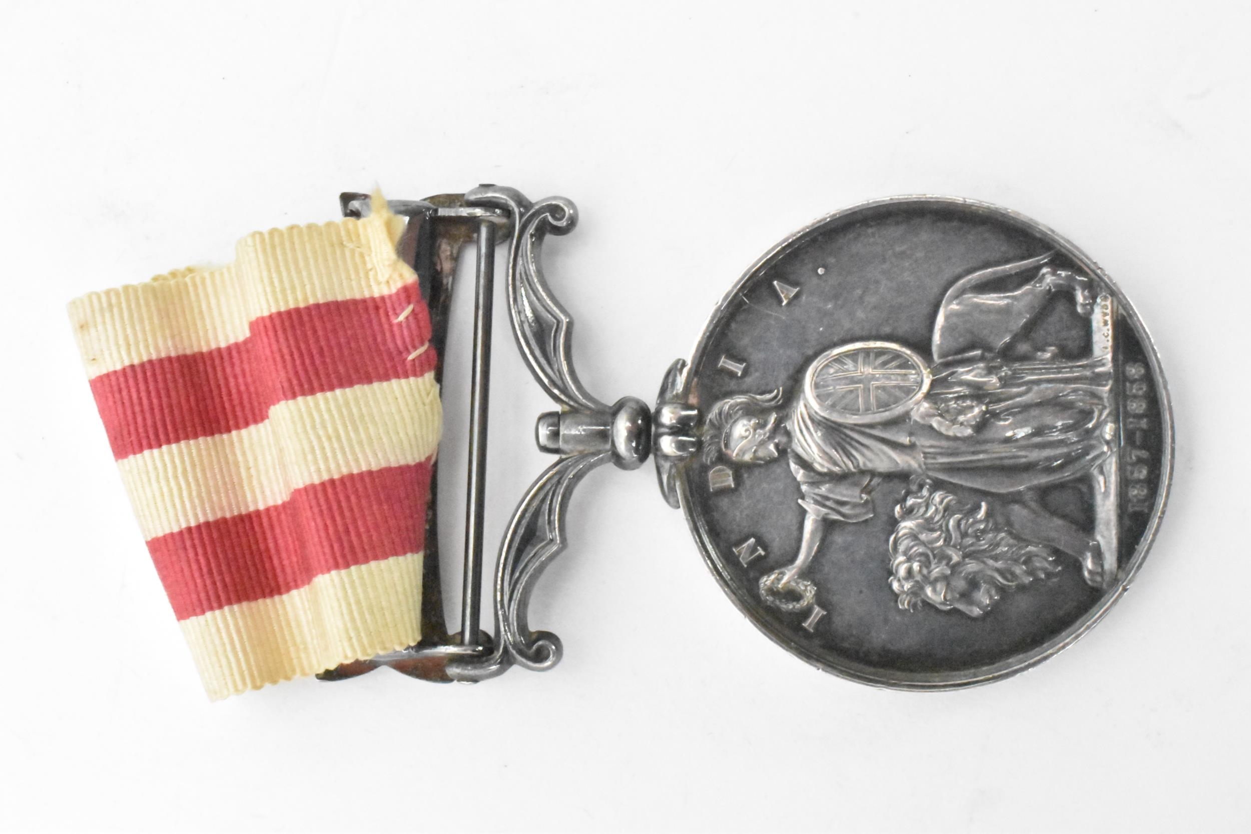 A Victorian Indian mutiny medal, 1857-58, with Delhi clasp, awarded to CORPL D,DIX 61ST REGT - Image 2 of 6