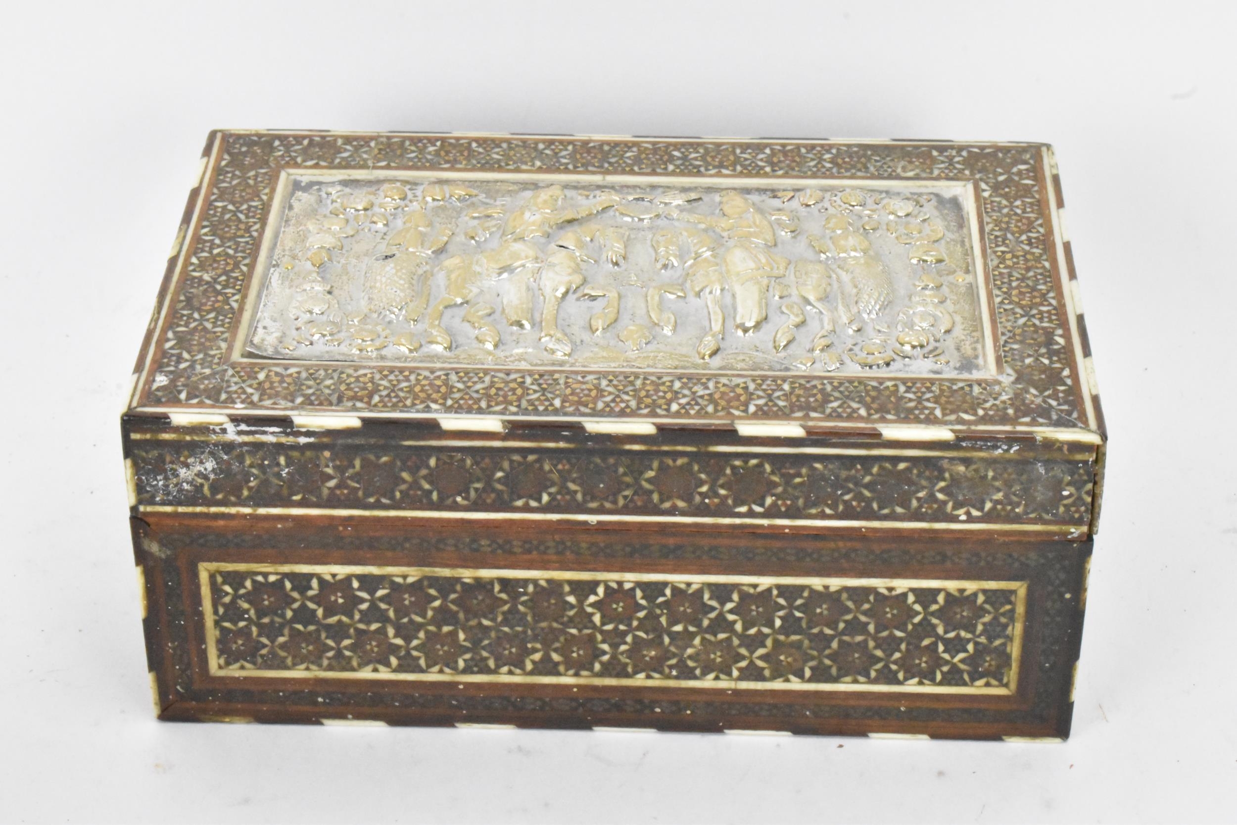 A late 19th century Indo-Persian katamkari cigarette box, decorated with a silver repousse panel