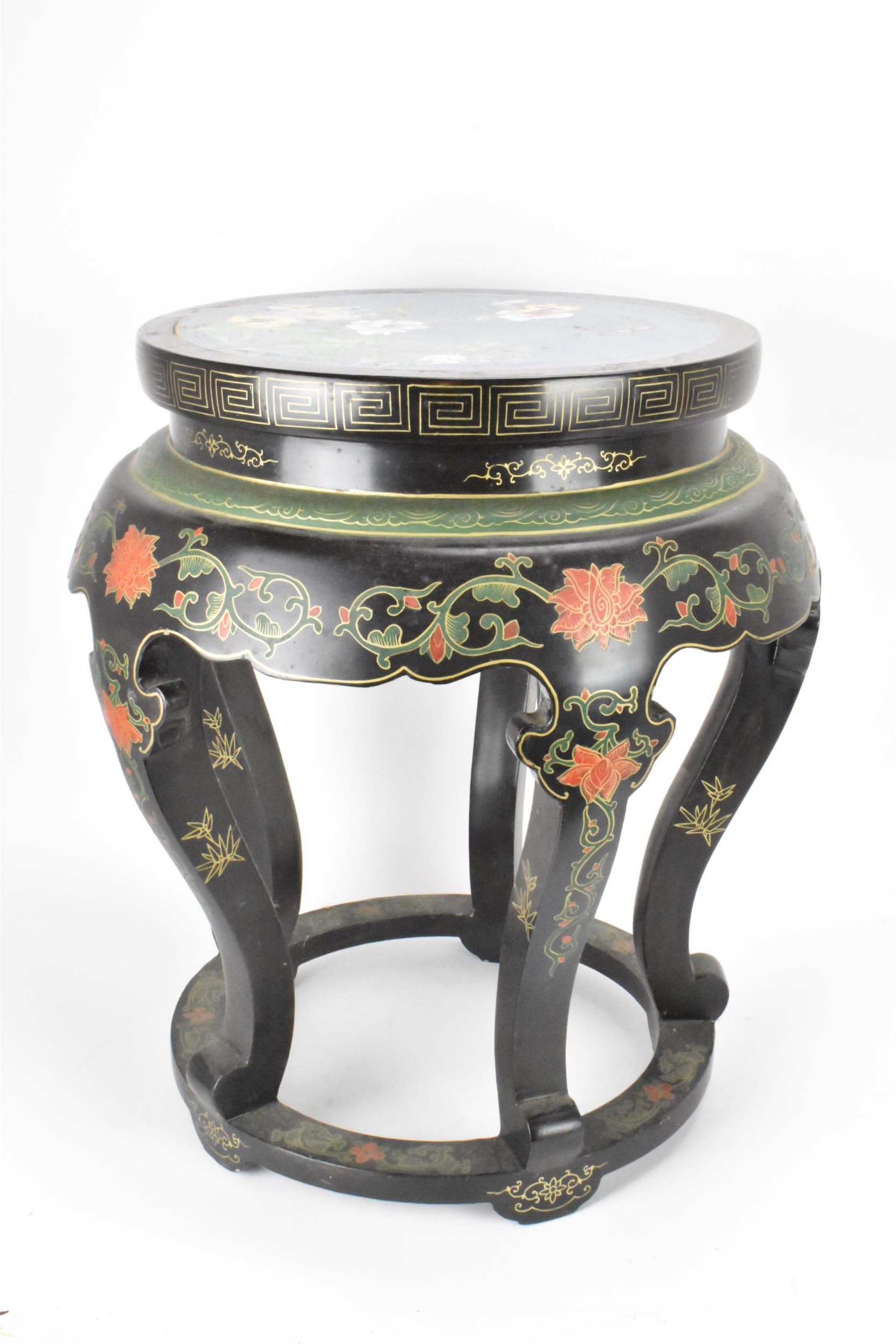 A Chinese 20th century occasional table, having a black lacquered frame supported by five curved - Image 4 of 7