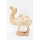 A Chinese terracotta model of a camel, possibly tang dynasty, 14.5cm high x 11cm wide