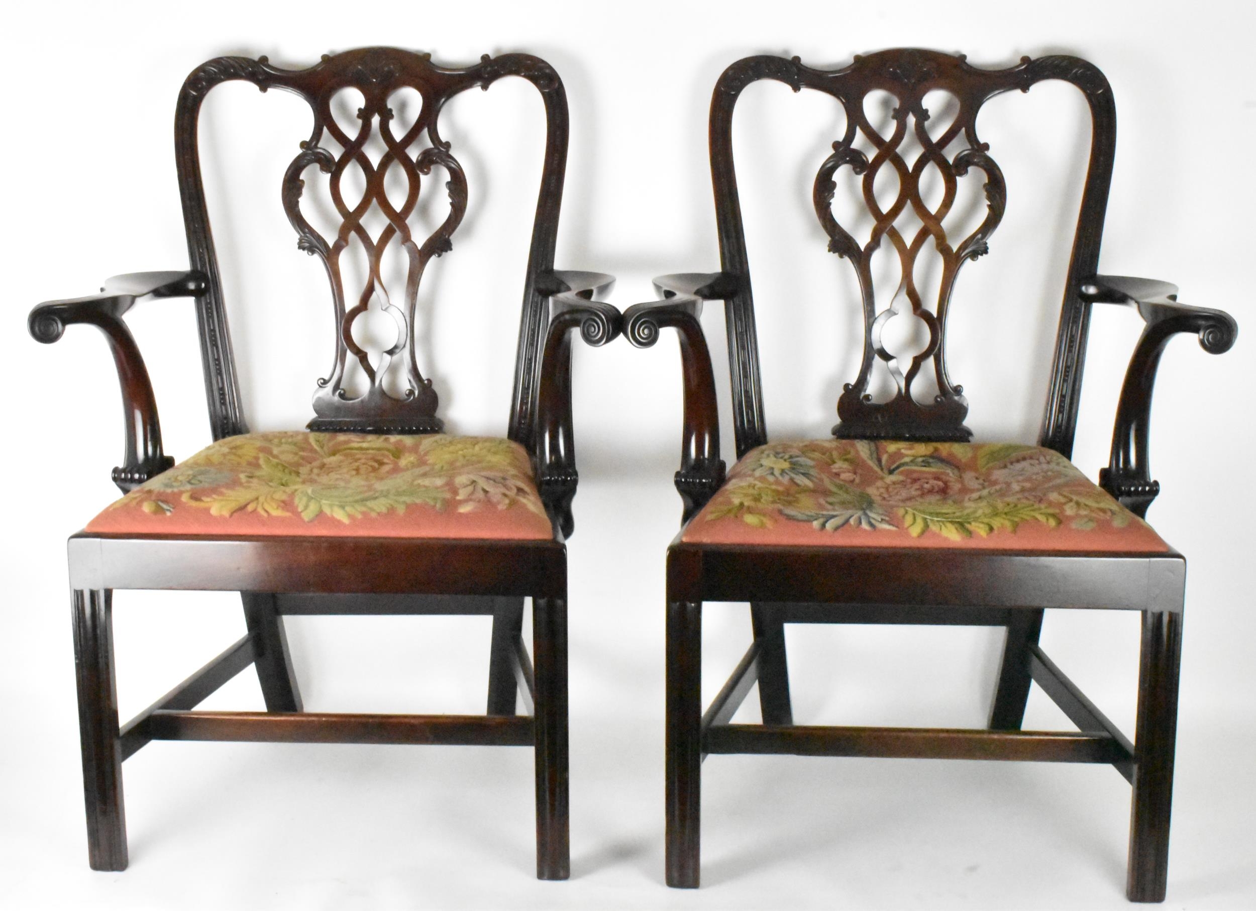 A pair of late 19th century mahogany Chippendale style carver chairs, carved with C scrolls, egg and
