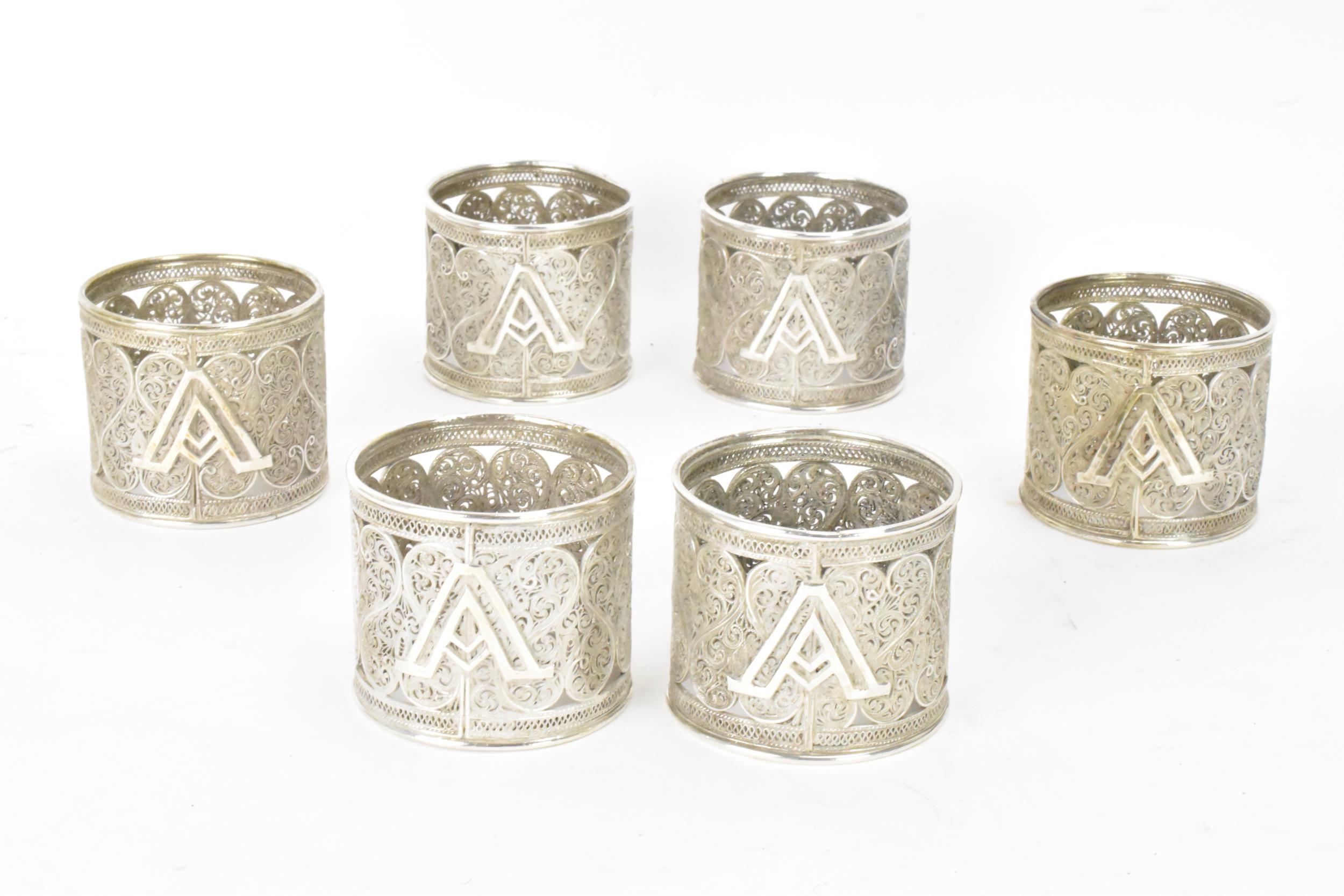 A set of six early 20th century Middle Eastern white metal filigree napkin rings, elaborately - Image 2 of 6