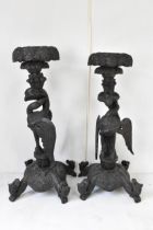 A pair of late 19th century Anglo-Indian colonial ebonized carved plant stands, each having ornately