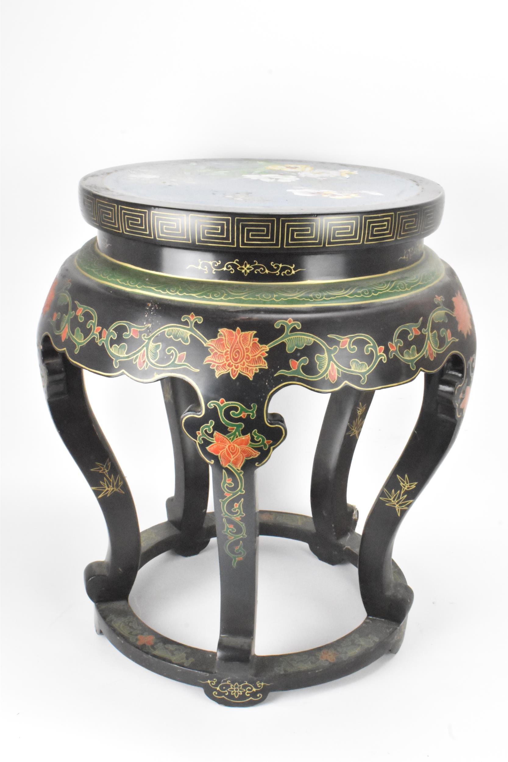 A Chinese 20th century occasional table, having a black lacquered frame supported by five curved - Image 5 of 7