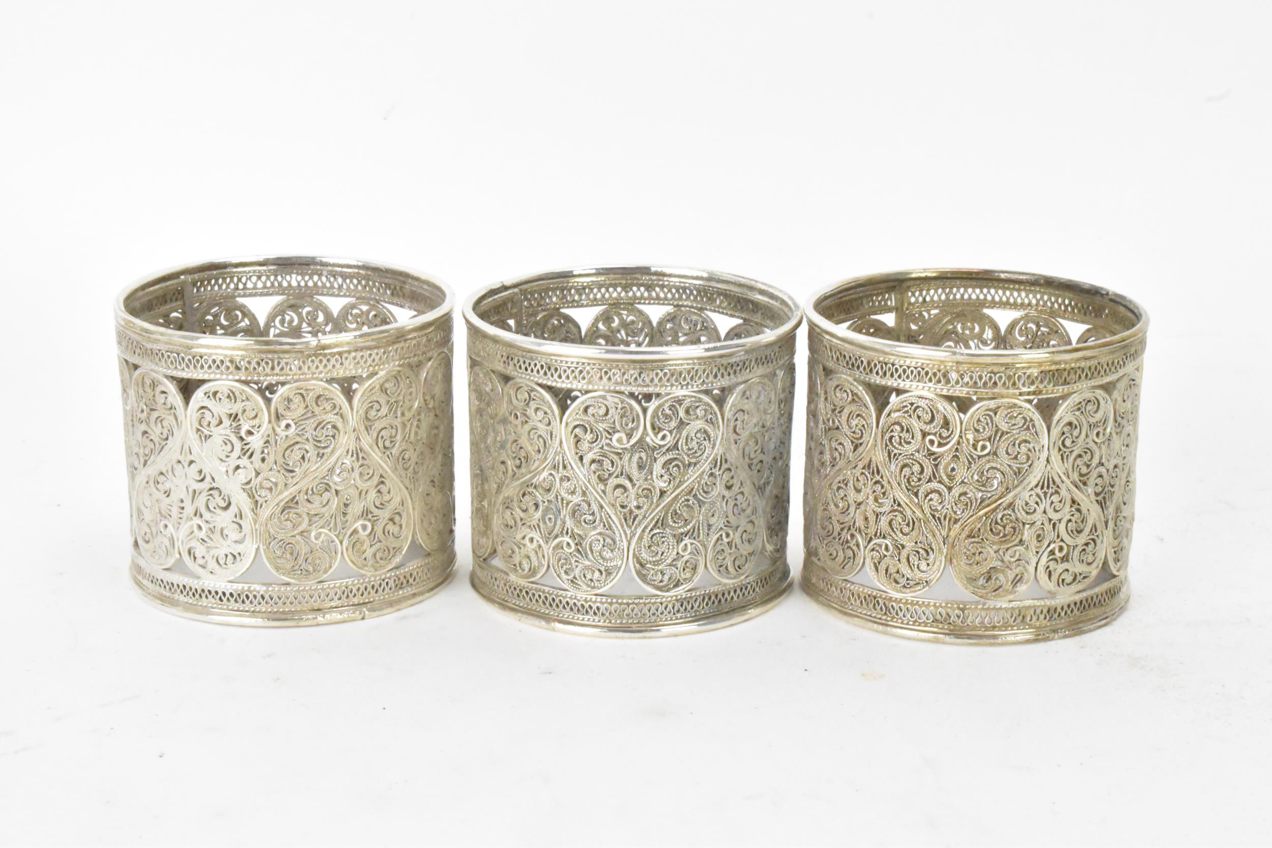 A set of six early 20th century Middle Eastern white metal filigree napkin rings, elaborately - Image 6 of 6