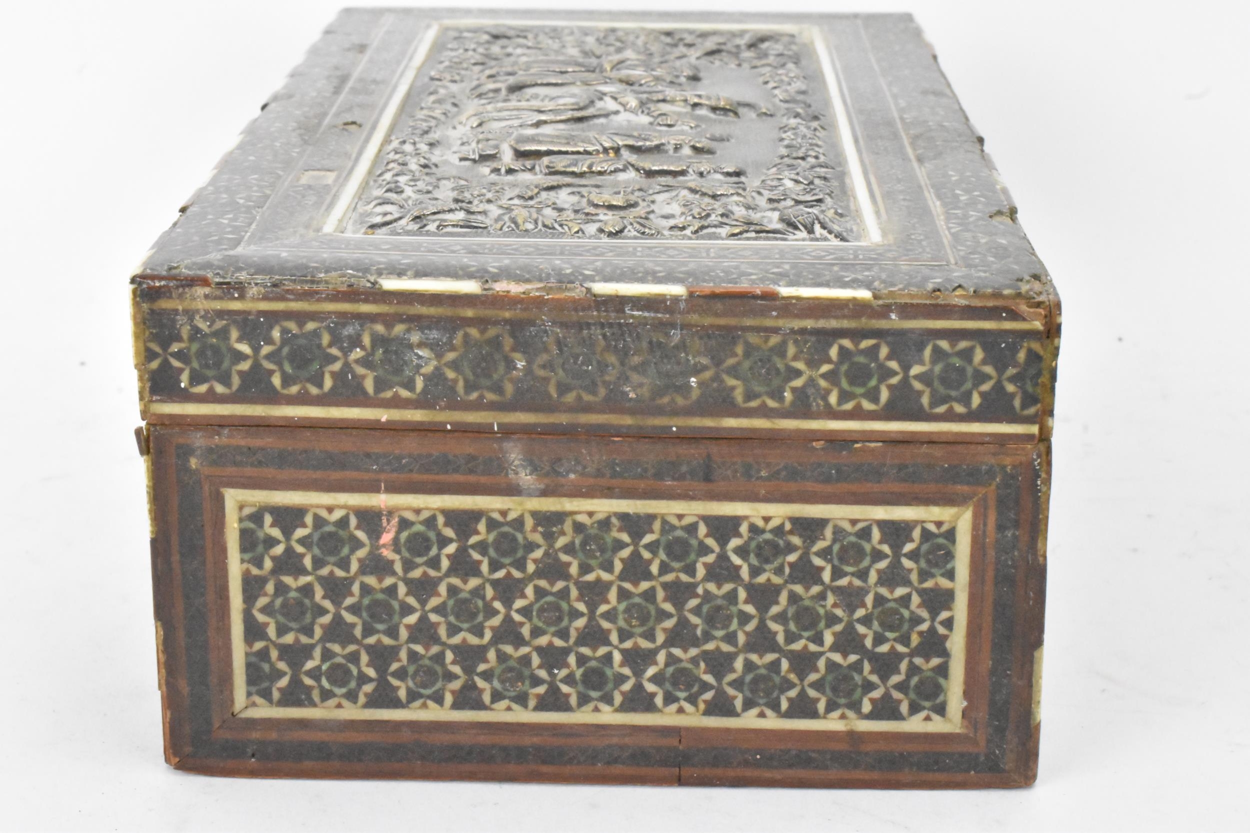 A late 19th century Indo-Persian cigarette box, decorated with a silver repousse panel to the lid - Image 3 of 7