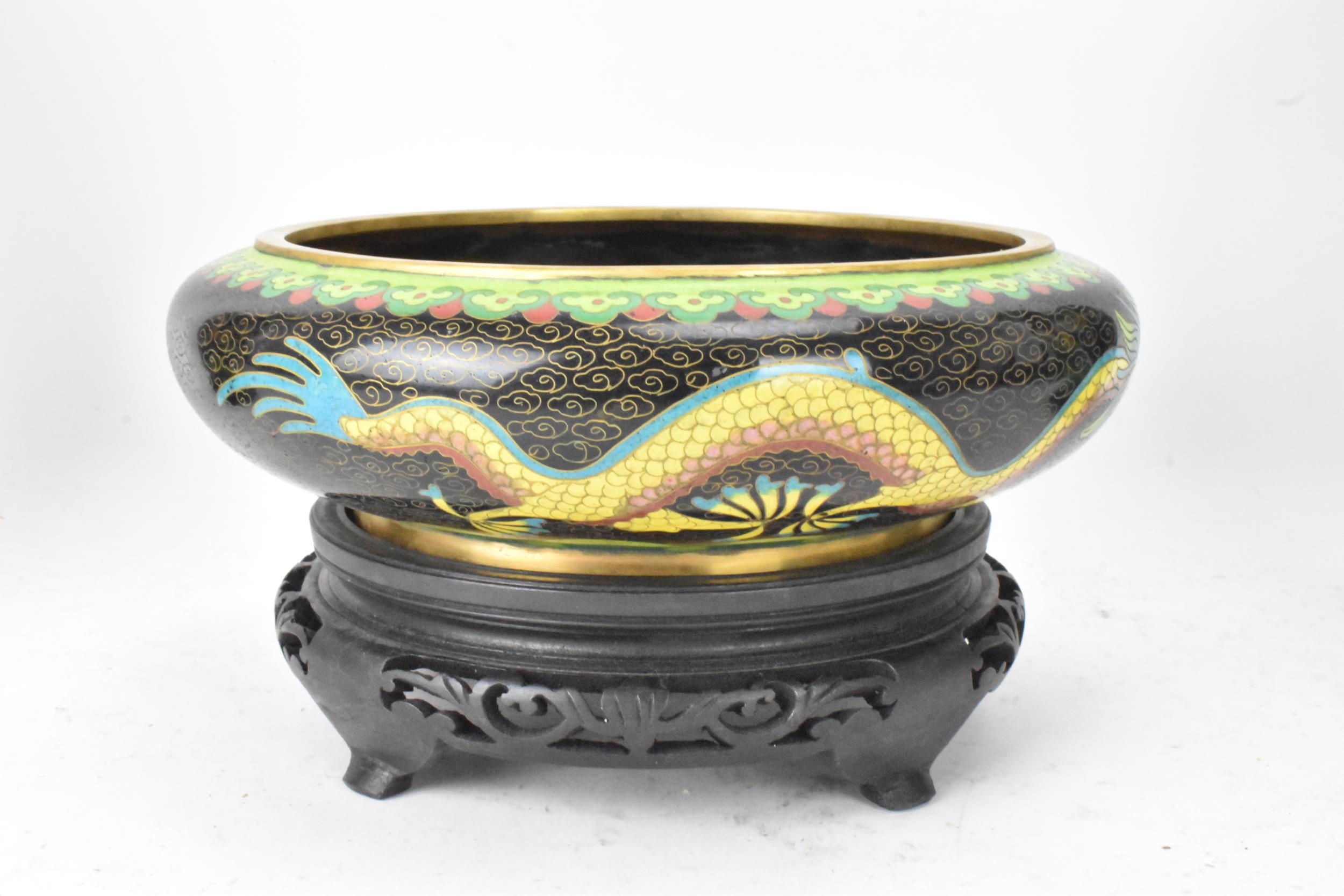 A pair of Chinese mid 20th century cloisonne vases and a bowl, all with black grounds decorated with - Image 8 of 12