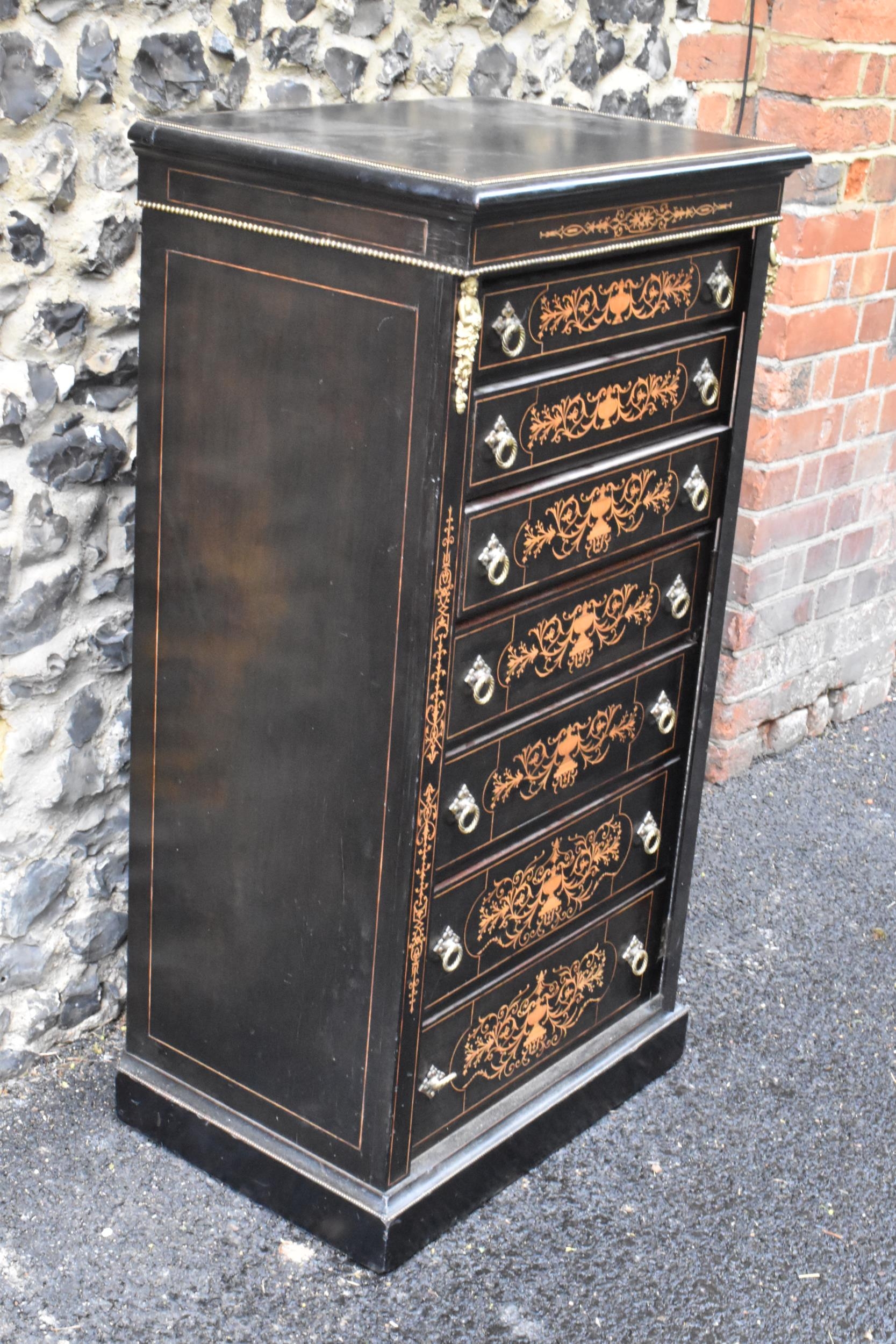 A late Victorian ebonised wellington chest of seven graduating drawers, applied gilt beading and - Image 2 of 6