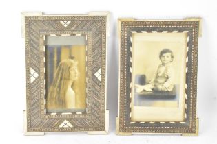 Two similar Persian late Qajar dynasty photograph frames, the profusely inlaid frames having multi