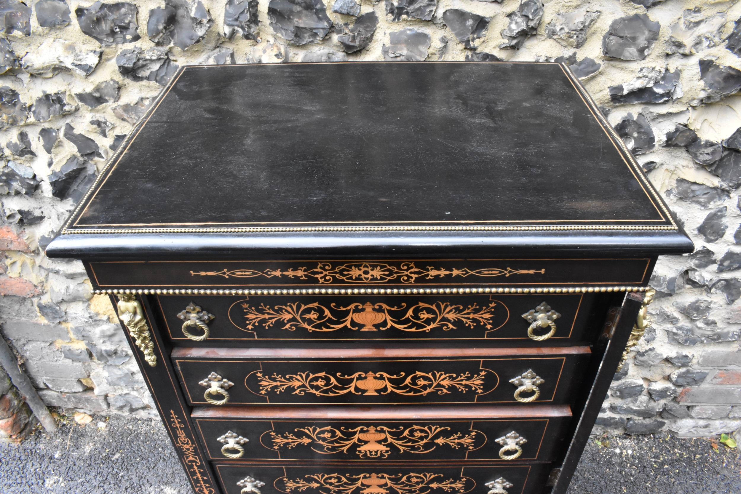 A late Victorian ebonised wellington chest of seven graduating drawers, applied gilt beading and - Image 5 of 6