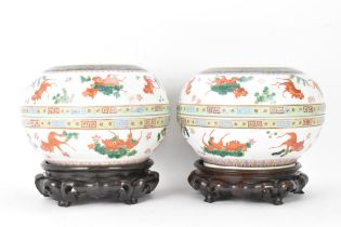 Two Chinese famille rose circular formed lidded boxes, early 20th century, decorated in polychrome