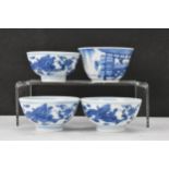 Three Chinese 20th century blue and white bowls, decorated with dragons and interiors with central