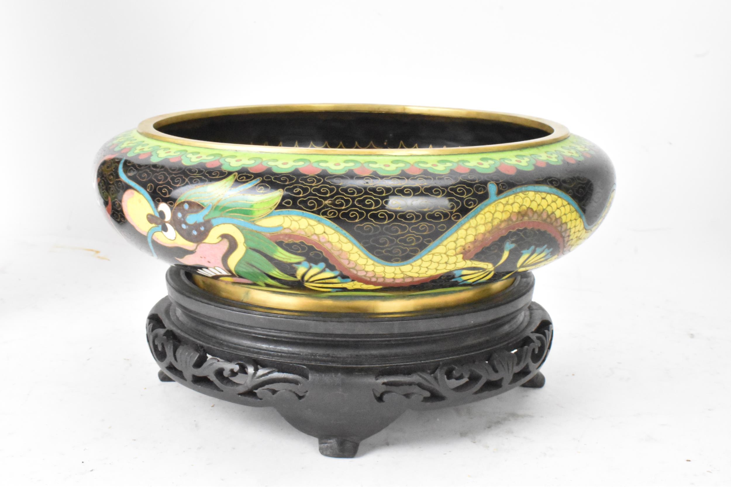 A pair of Chinese mid 20th century cloisonne vases and a bowl, all with black grounds decorated with - Image 10 of 12