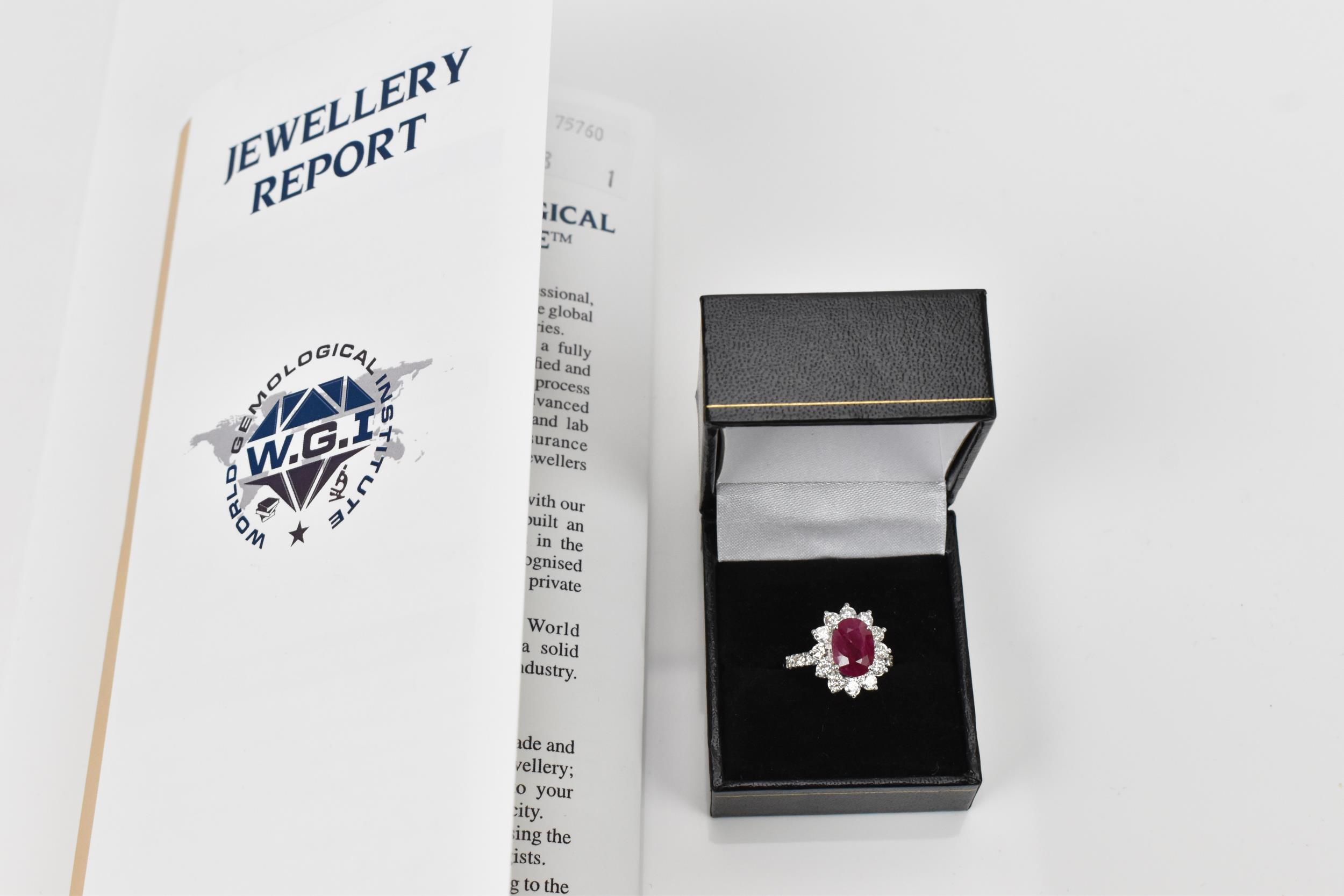 An 18ct white gold, diamond and ruby dress ring, set with central oval mixed cut ruby in four claw - Bild 9 aus 12