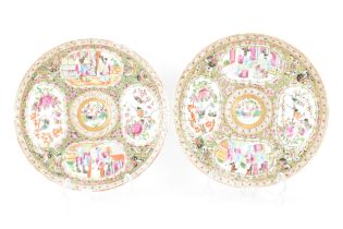 A pair of Chinese export late 19th century Canton Famille Rose porcelain plates, in polychrome