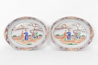 A pair of Chinese export Famille Rose serving dishes, Qianlong, late 18th century, of oval form, the