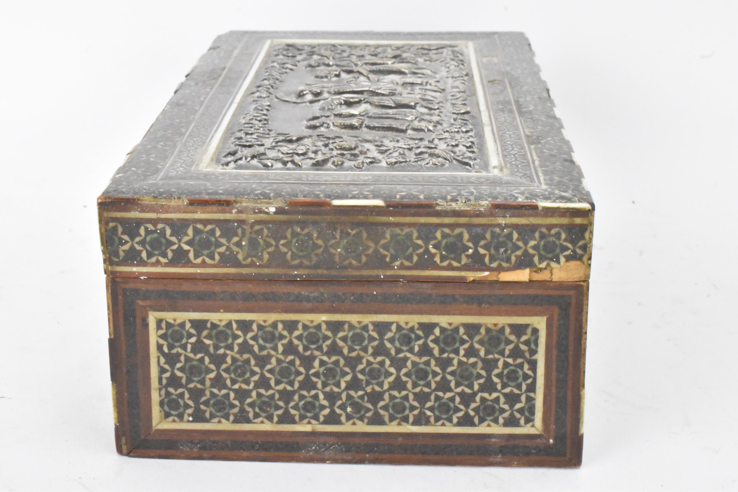 A late 19th century Indo-Persian cigarette box, decorated with a silver repousse panel to the lid - Image 5 of 7