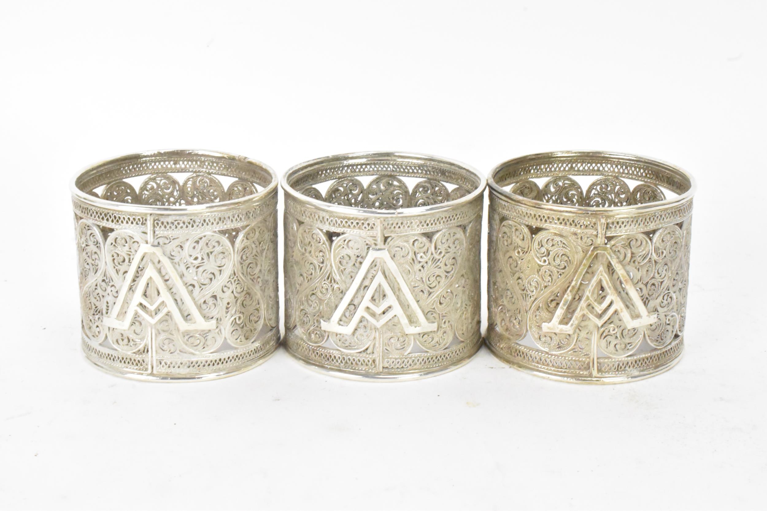 A set of six early 20th century Middle Eastern white metal filigree napkin rings, elaborately - Image 5 of 6
