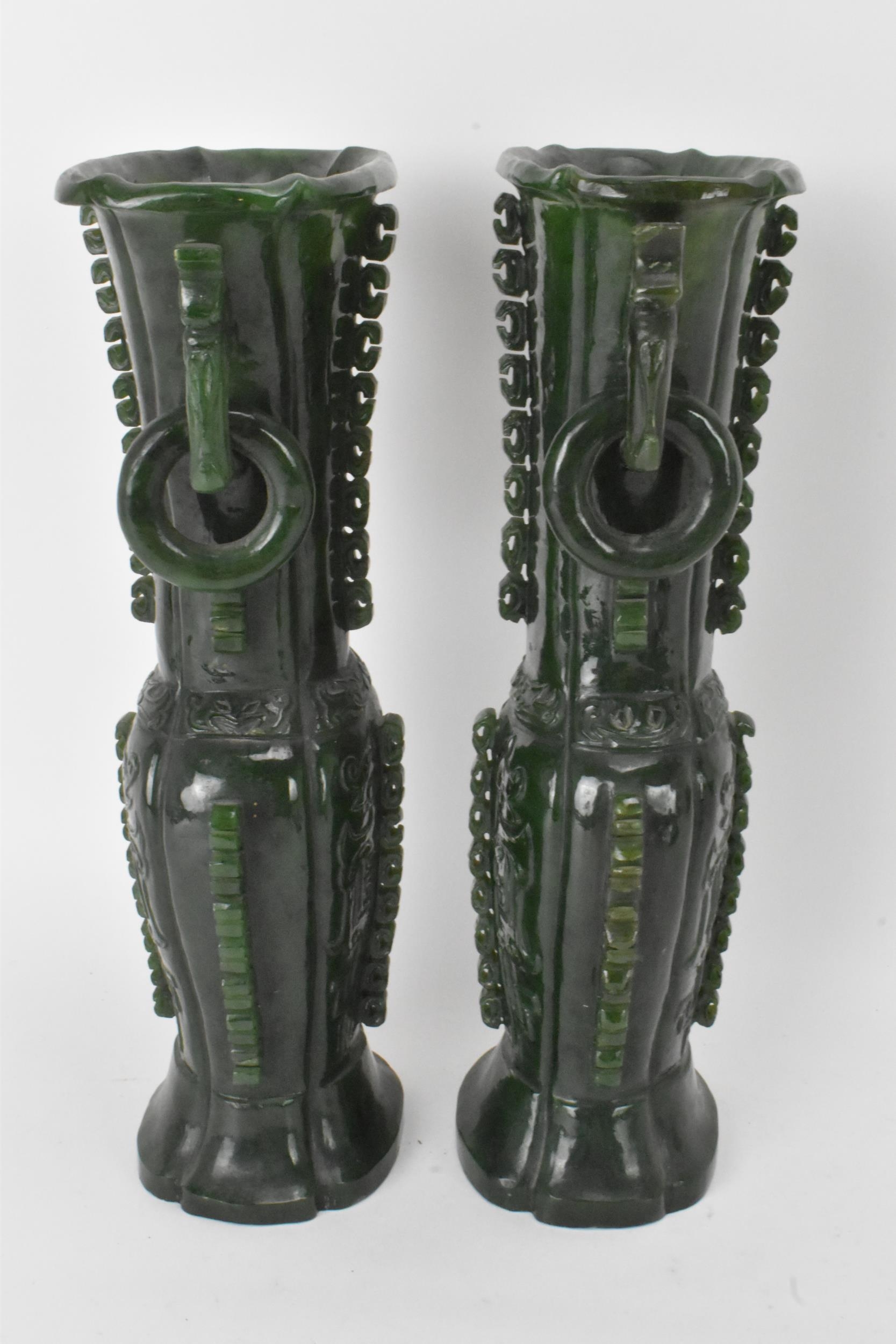 A pair of Chinese 20th century jadeite vases, of flattened baluster shape with archaistic relief - Image 4 of 7