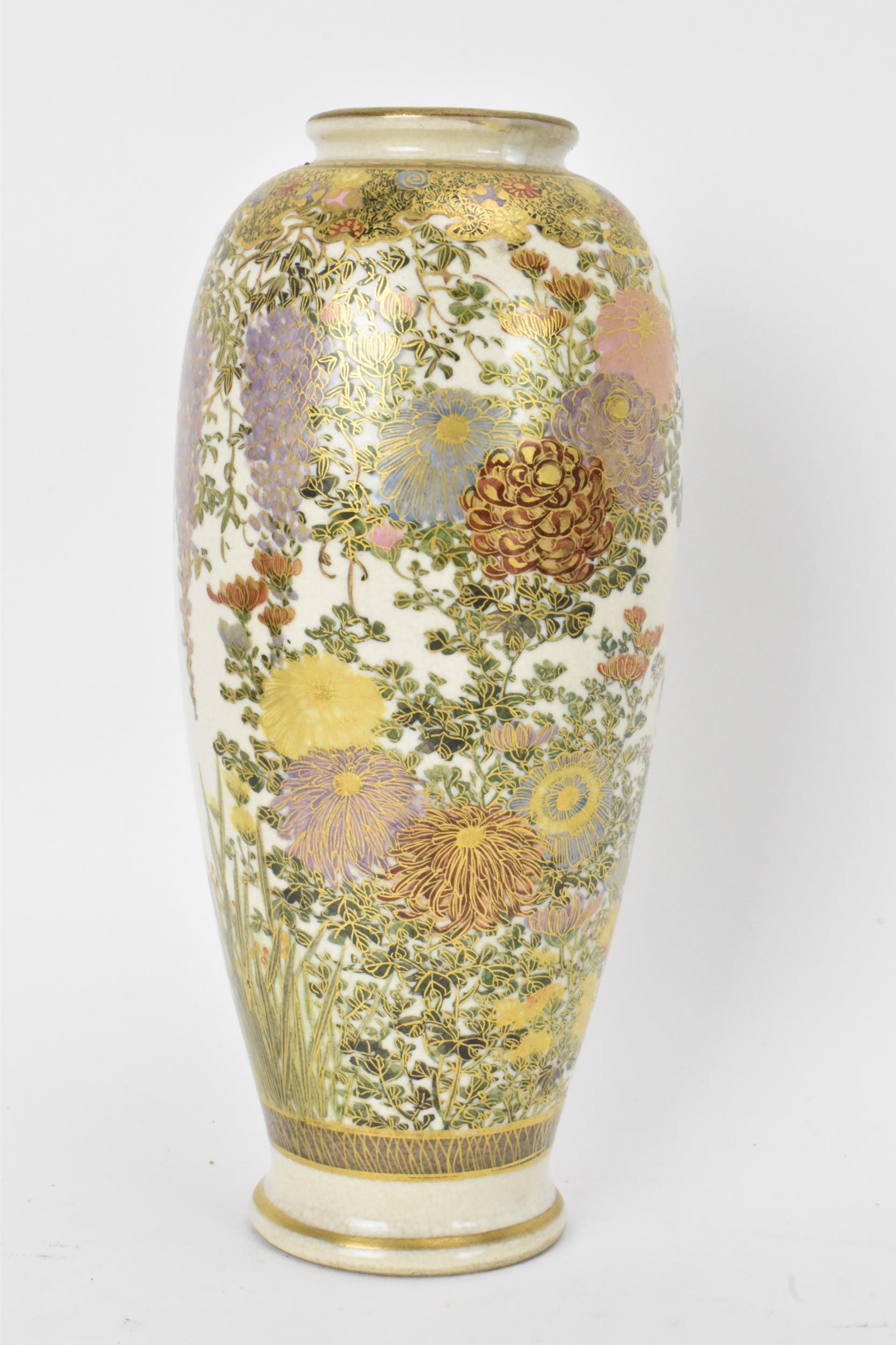 A Japanese Meiji period satsuma vase, of ovoid shape with flared rim, decorated with floral sprays