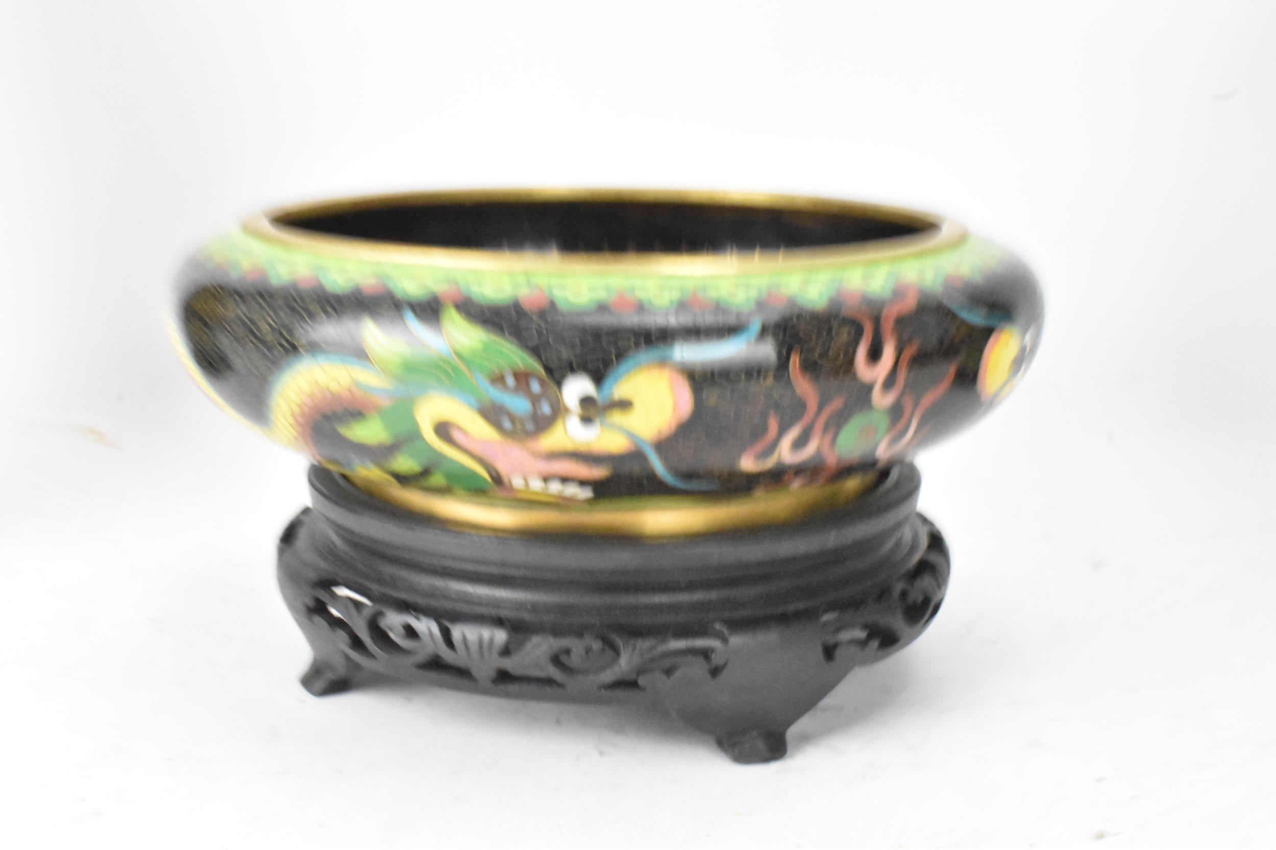 A pair of Chinese mid 20th century cloisonne vases and a bowl, all with black grounds decorated with - Image 9 of 12