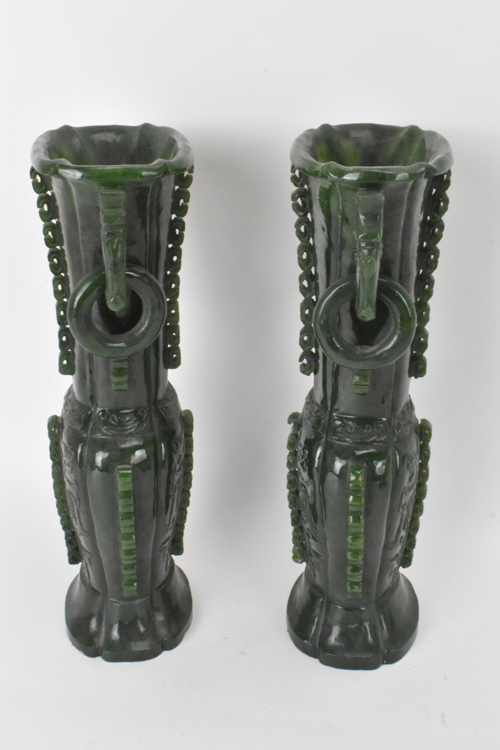 A pair of Chinese 20th century jadeite vases, of flattened baluster shape with archaistic relief - Image 6 of 7