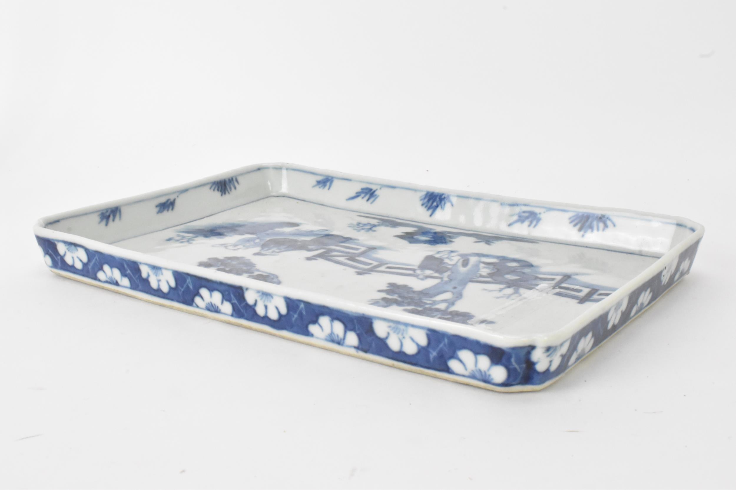 A 19th century Chinese blue and white tray, of rectangular shape and painted with a scene of two - Image 3 of 4
