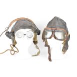 A collection of WWII flying accessories to include two flying hats including a Wareings example