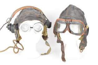 A collection of WWII flying accessories to include two flying hats including a Wareings example