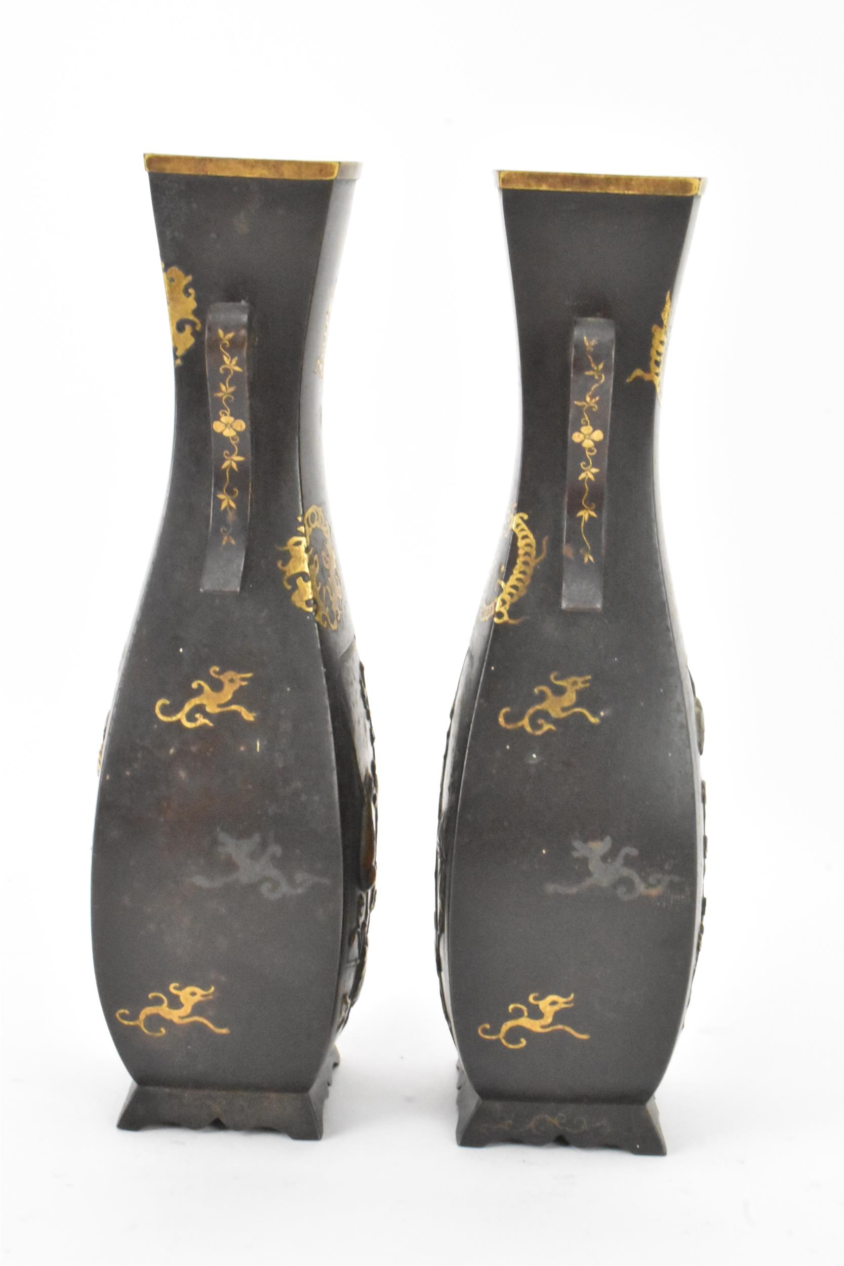 A pair of Japanese Meiji period iron vases, decorated with panels depicting birds and flowers in - Image 4 of 6