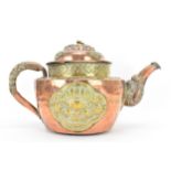 A 19th century Tibetan brass and copper large teapot, having an elephant formed spout, applied