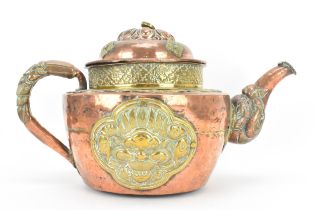 A 19th century Tibetan brass and copper large teapot, having an elephant formed spout, applied