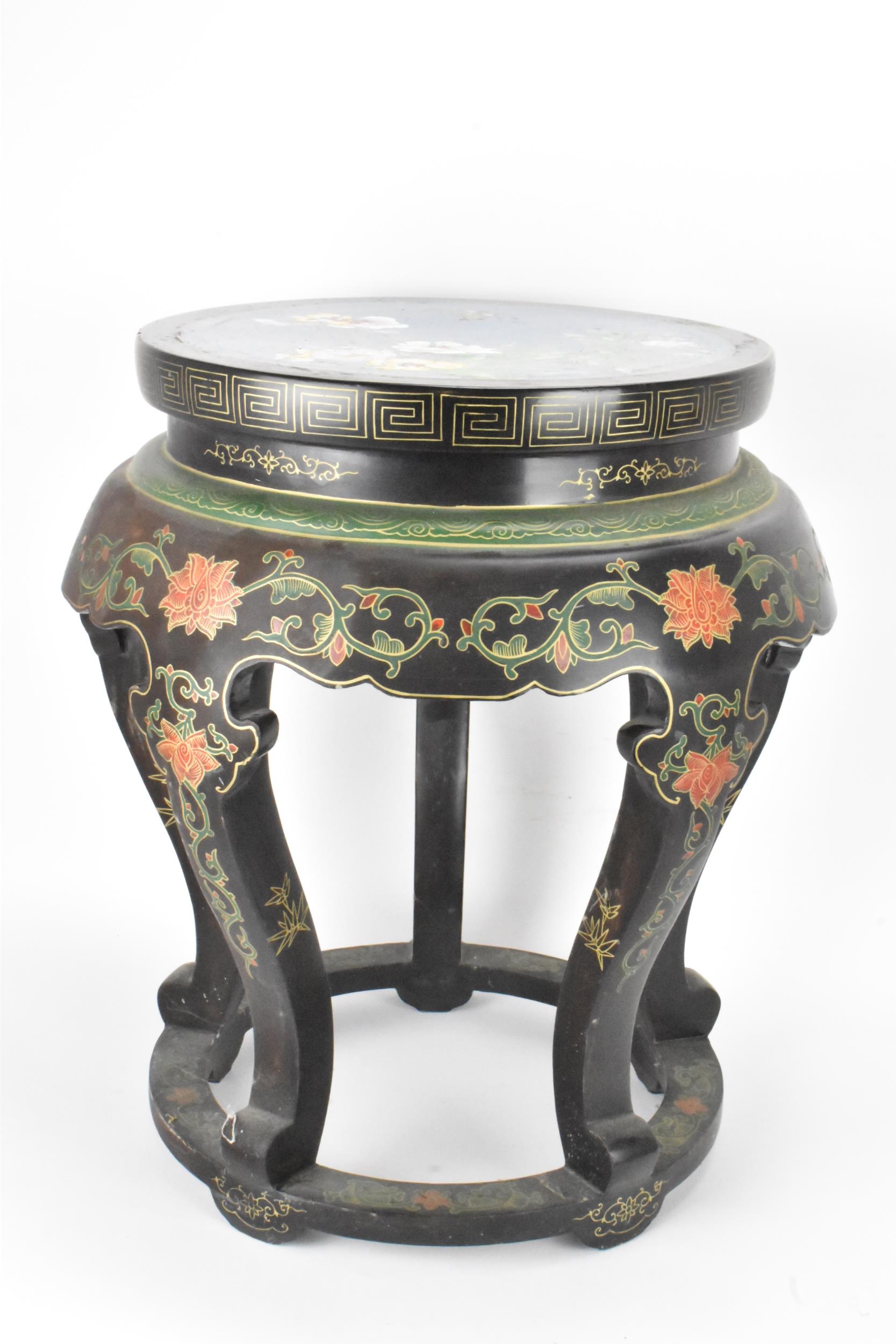 A Chinese 20th century occasional table, having a black lacquered frame supported by five curved - Image 3 of 7