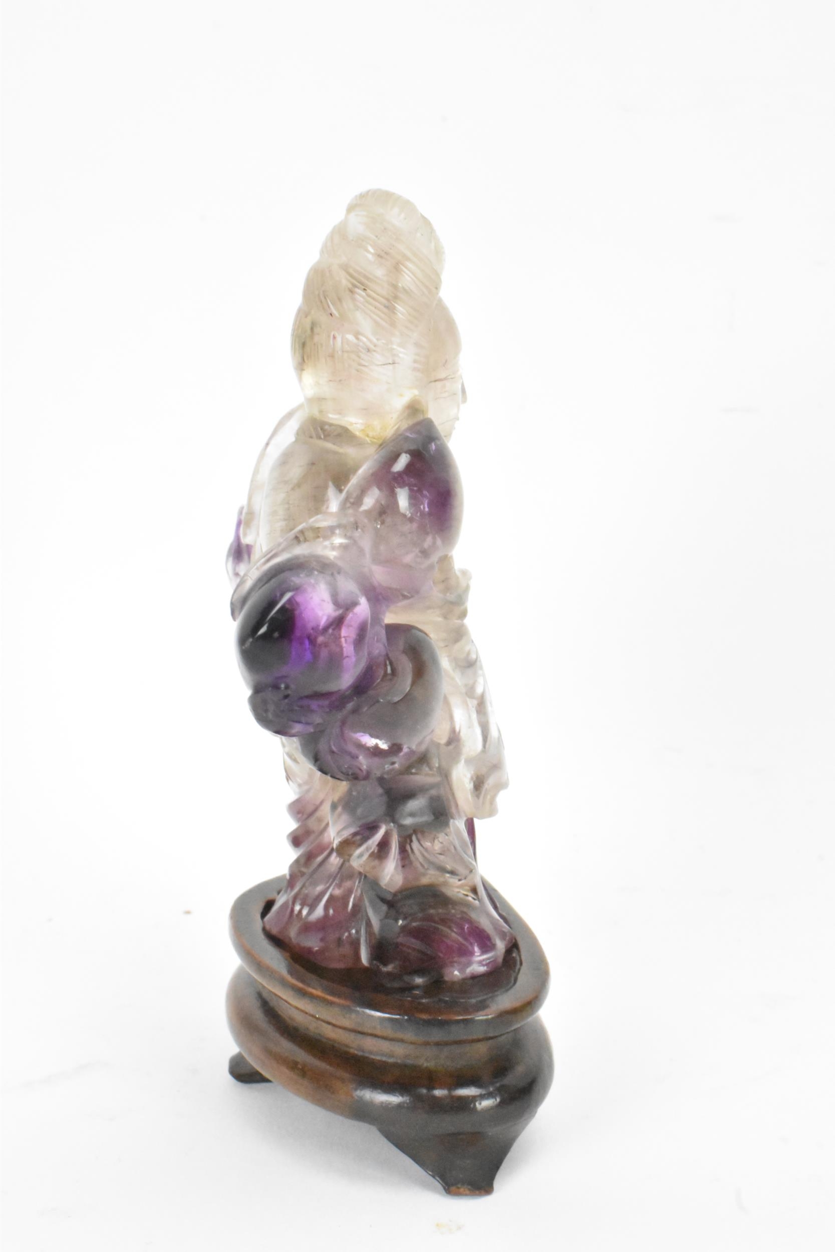 A 20th century Chinese carved amethyst figure of Guanyin, the goddess of mercy, in a seated position - Image 4 of 7