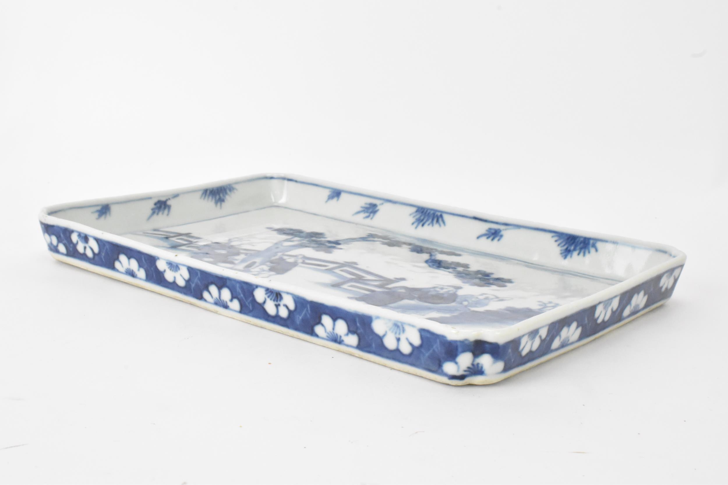 A 19th century Chinese blue and white tray, of rectangular shape and painted with a scene of two - Image 2 of 4