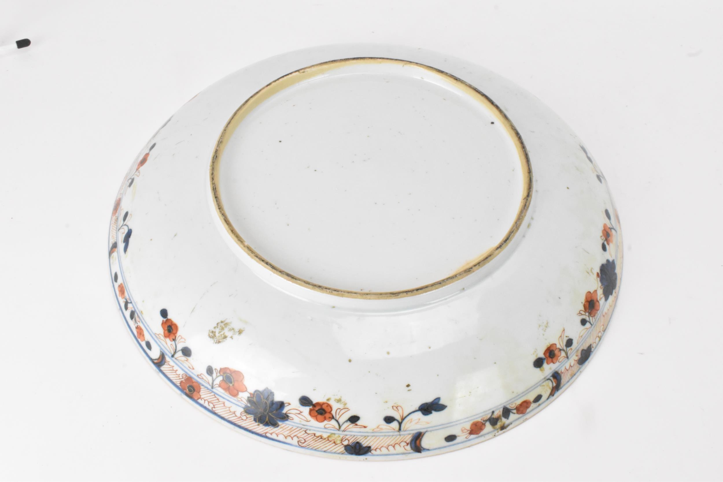 A Chinese Qing dynasty large powder blue dish, early 18th century, with gilt flora interior and - Image 2 of 8