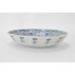 A pair of Qing Dynasty blue and white dishes, with fluted sides and barbed rim, decorated on the