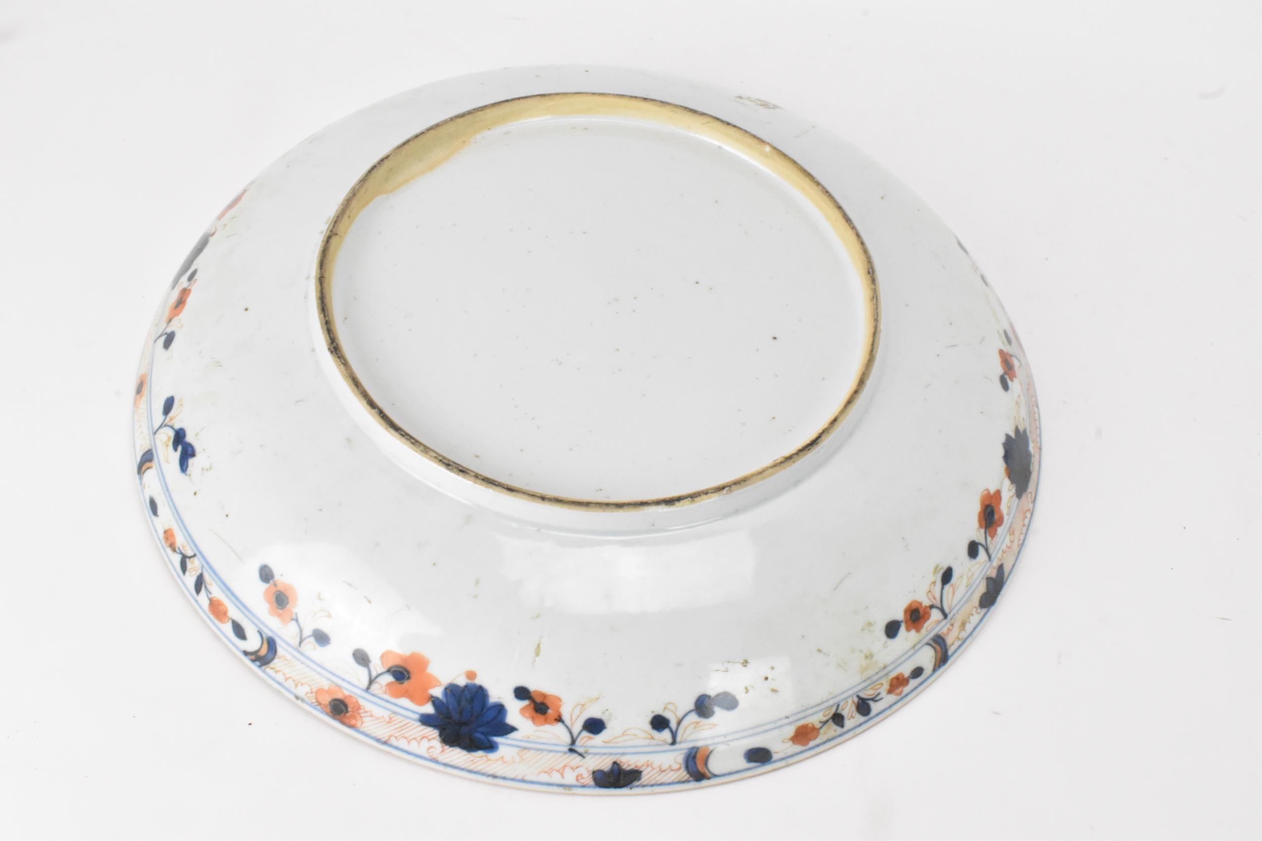 A Chinese Qing dynasty large powder blue dish, early 18th century, with gilt flora interior and - Image 4 of 8