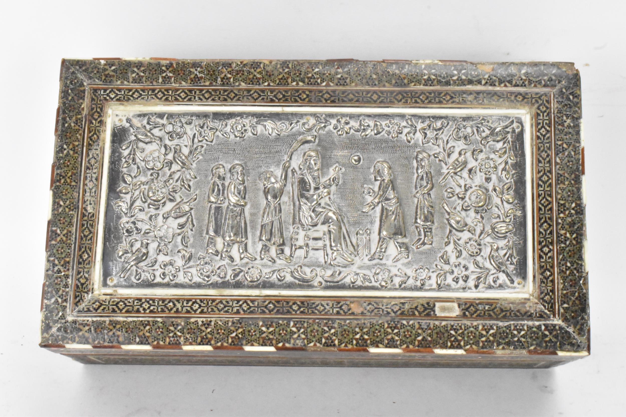 A late 19th century Indo-Persian cigarette box, decorated with a silver repousse panel to the lid - Image 2 of 7