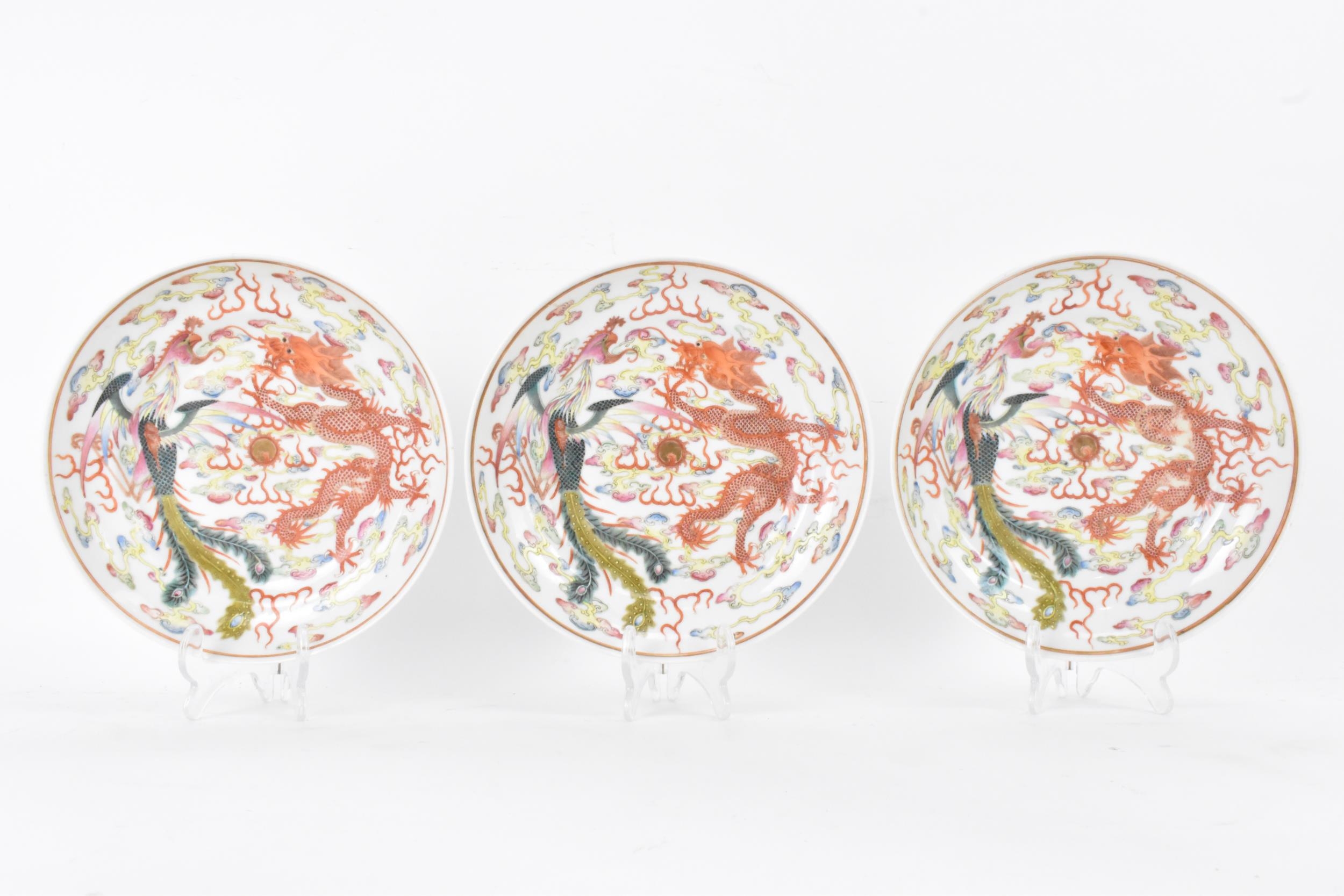 A set of three Chinese Xuantong period famille rose bowls, decorated in polychrome enamels with a