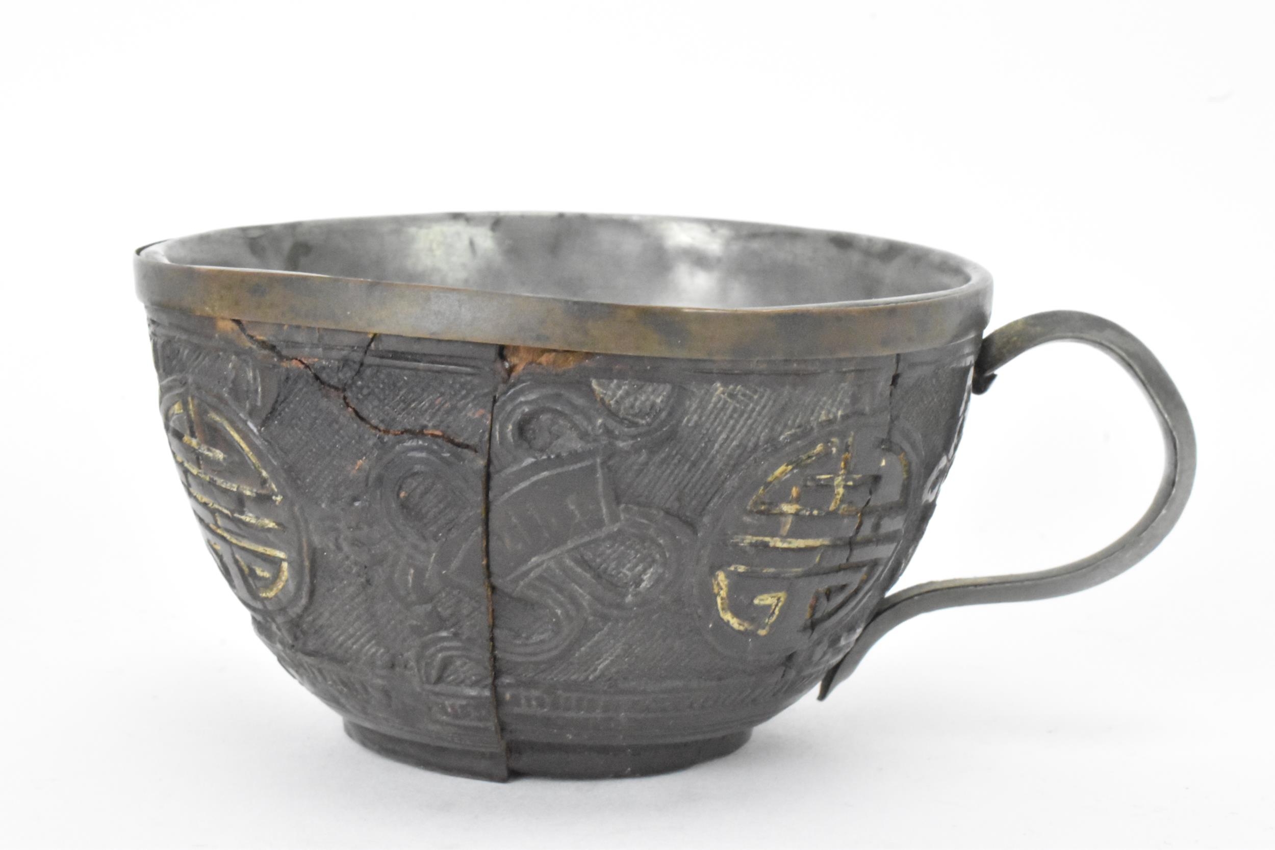 A Chinese late 19th/early 20th century coconut carved cup and saucer, both with pewter liners and - Image 3 of 8