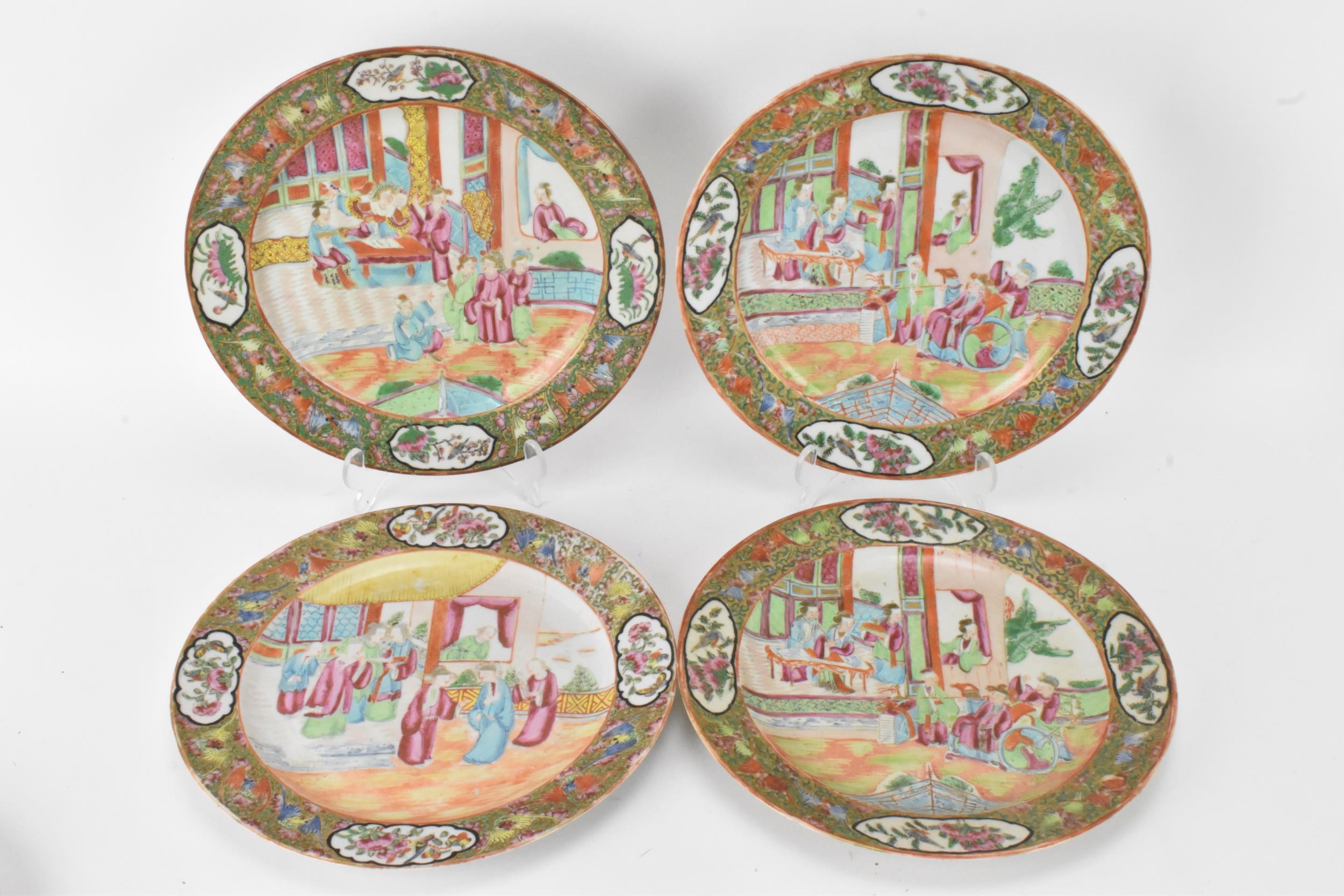 A set of four Chinese export Canton Famille Rose plates, Qing Dynasty, late 19th century, each