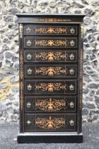 A late Victorian ebonised wellington chest of seven graduating drawers, applied gilt beading and