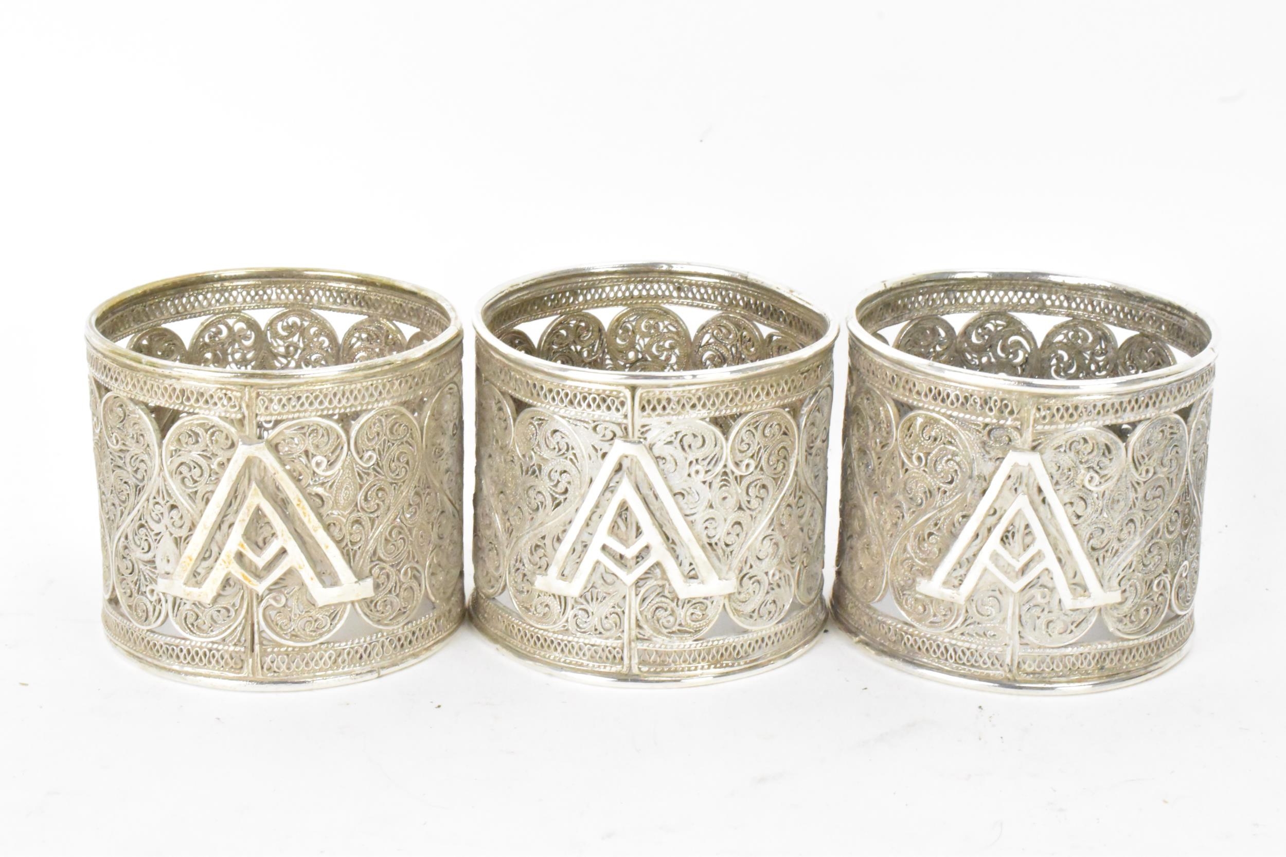 A set of six early 20th century Middle Eastern white metal filigree napkin rings, elaborately - Image 3 of 6