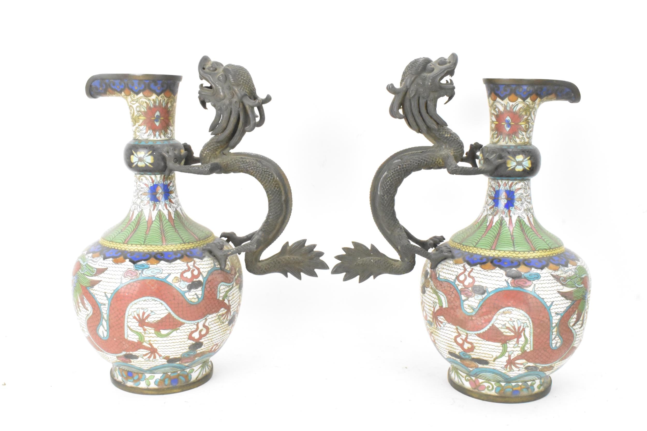 A pair of Chinese late Qing dynasty cloisonne ewers, both having a handle modelled in the form of - Image 3 of 6