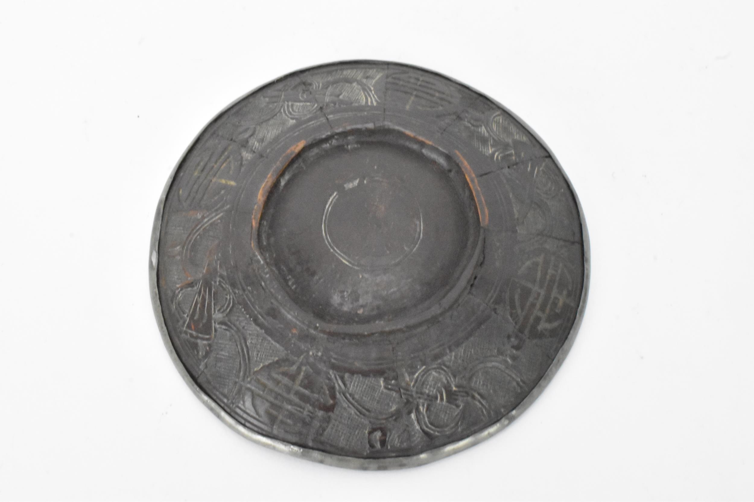 A Chinese late 19th/early 20th century coconut carved cup and saucer, both with pewter liners and - Image 8 of 8