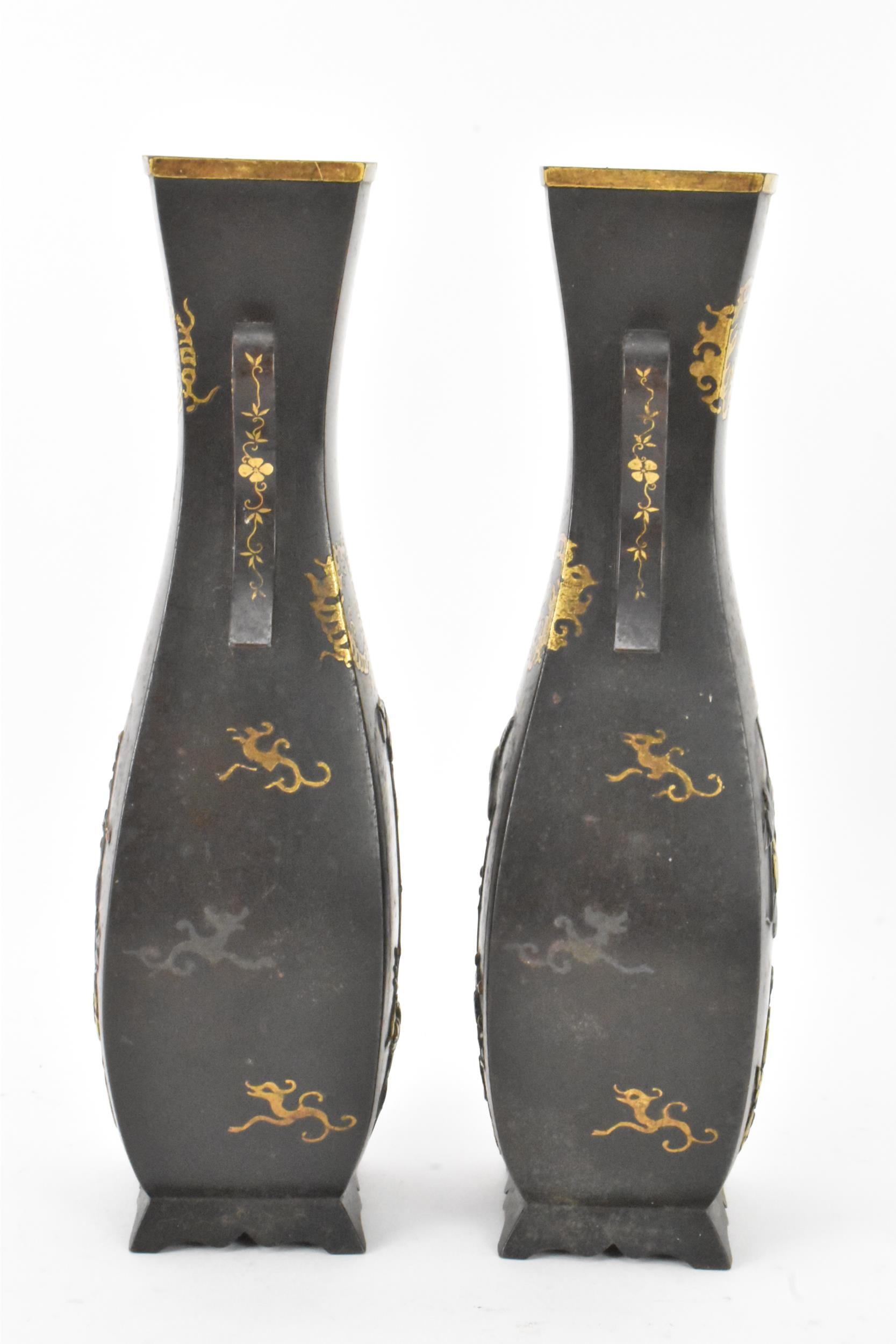 A pair of Japanese Meiji period iron vases, decorated with panels depicting birds and flowers in - Image 2 of 6